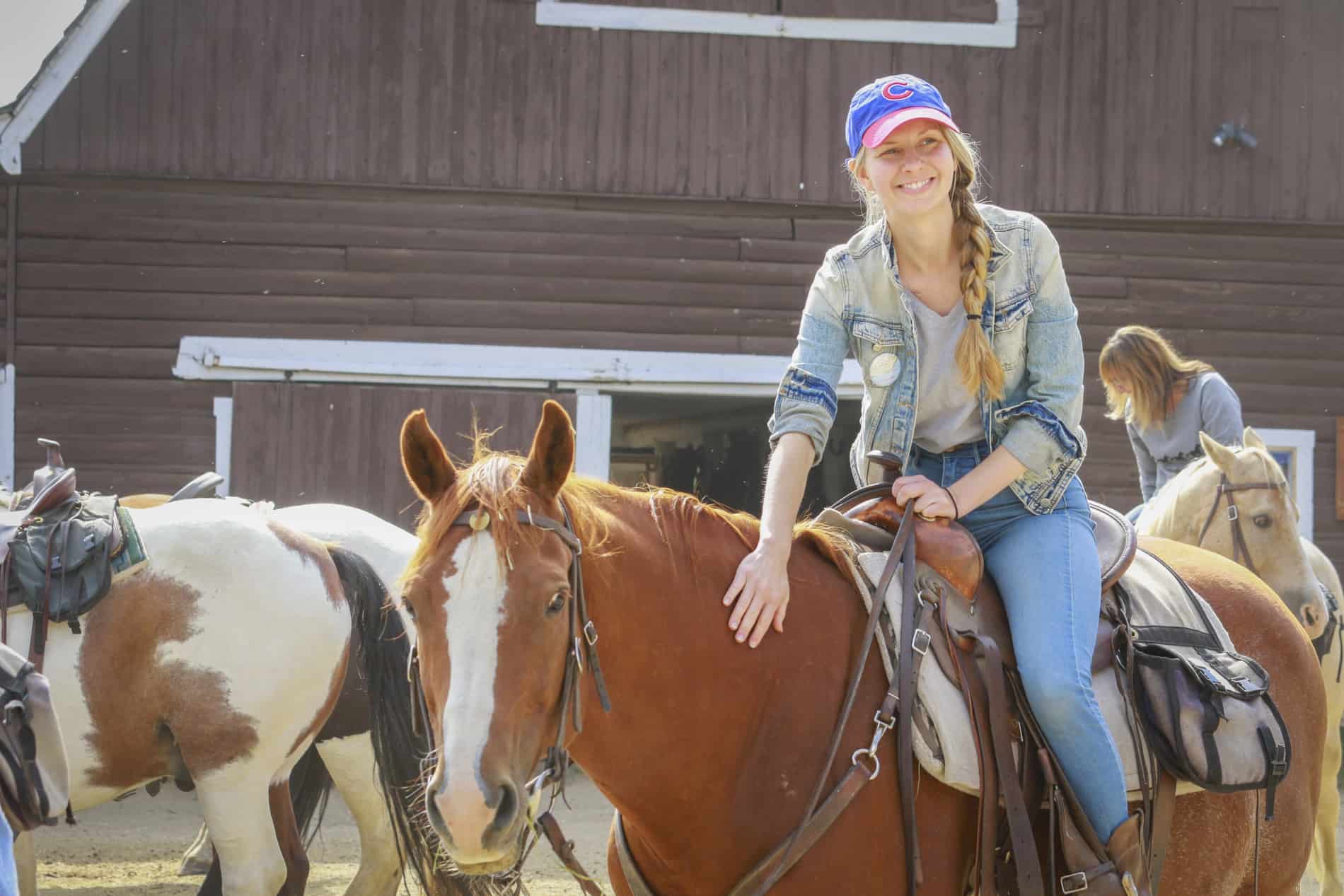 beginner horse rider at dude ranch