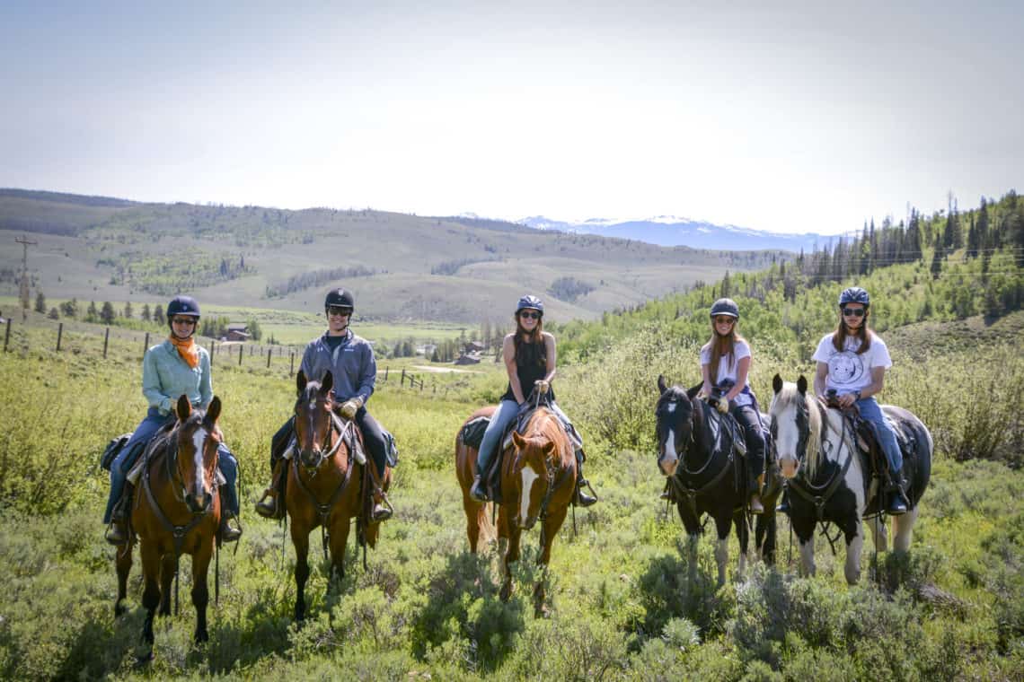 group of riders on horses