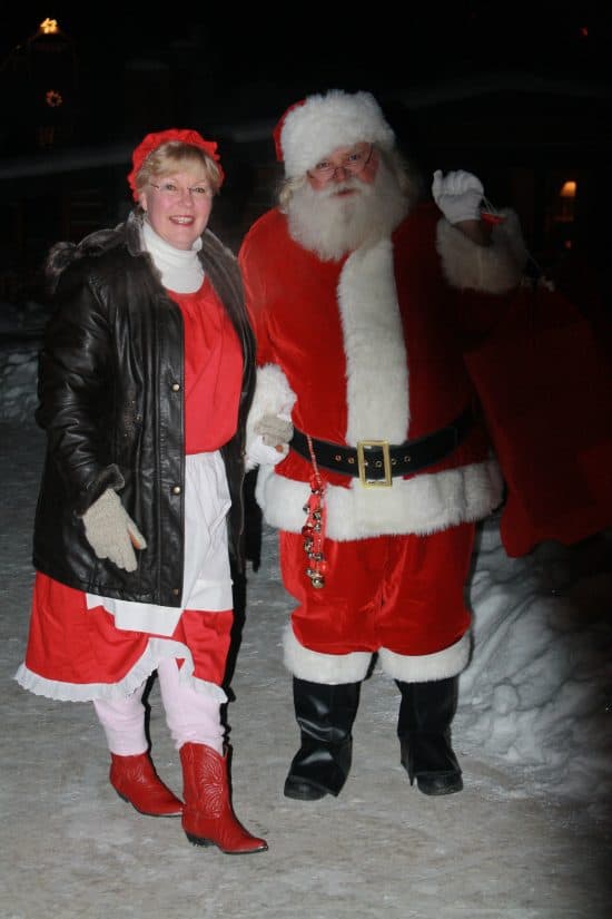 Santa and Mrs. Clause make their way to the lodge