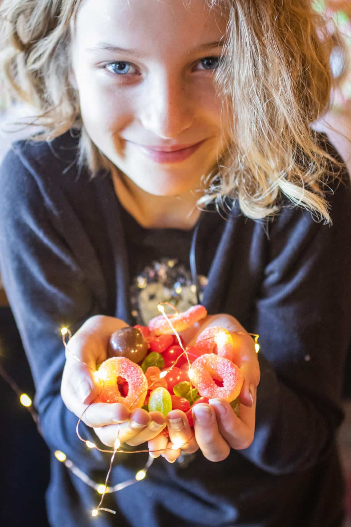 girl holding candy