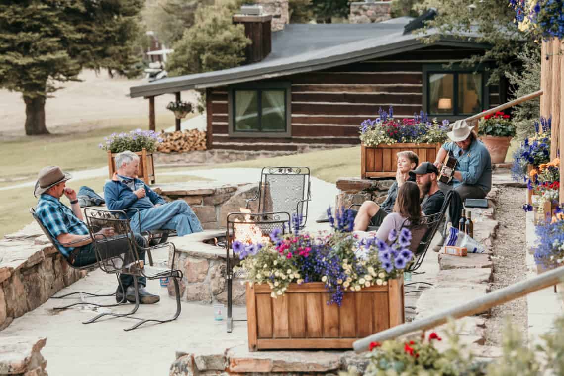 people hanging around fire pit