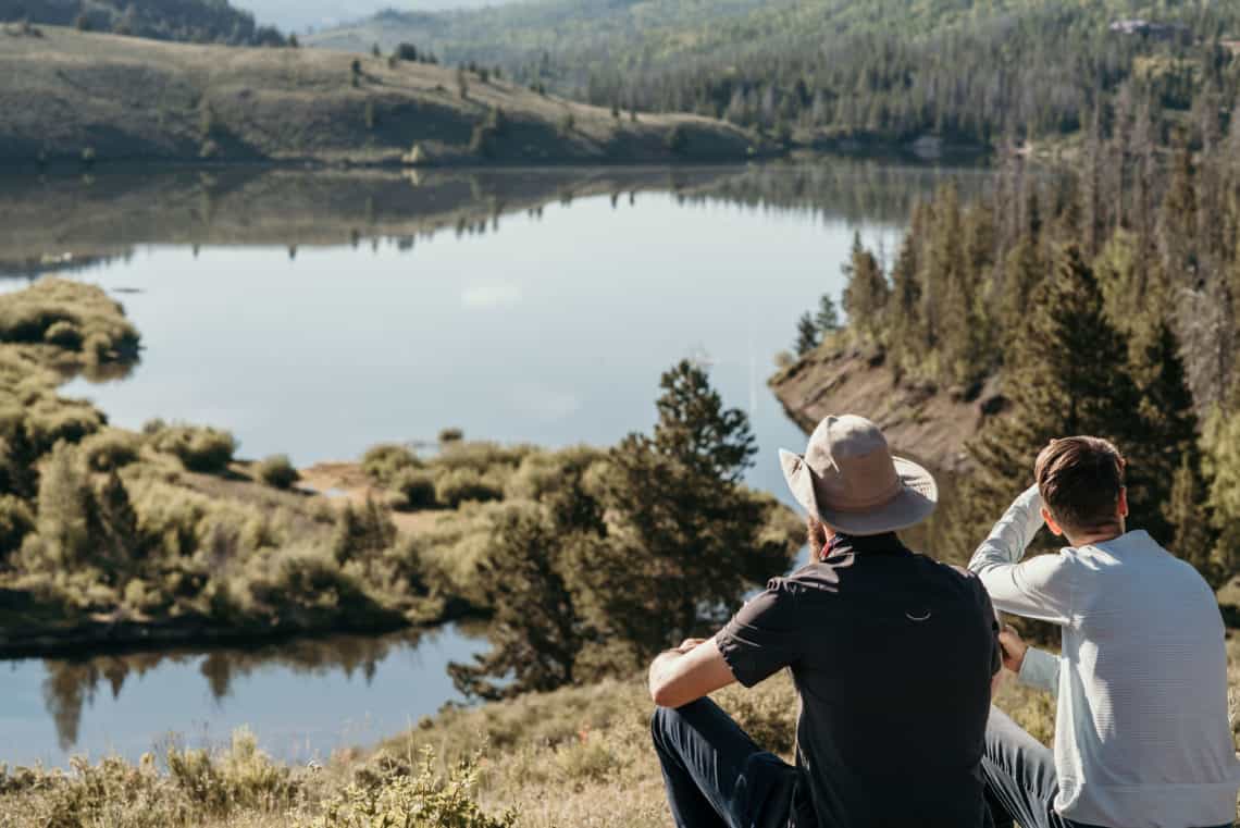 two guys looking at view