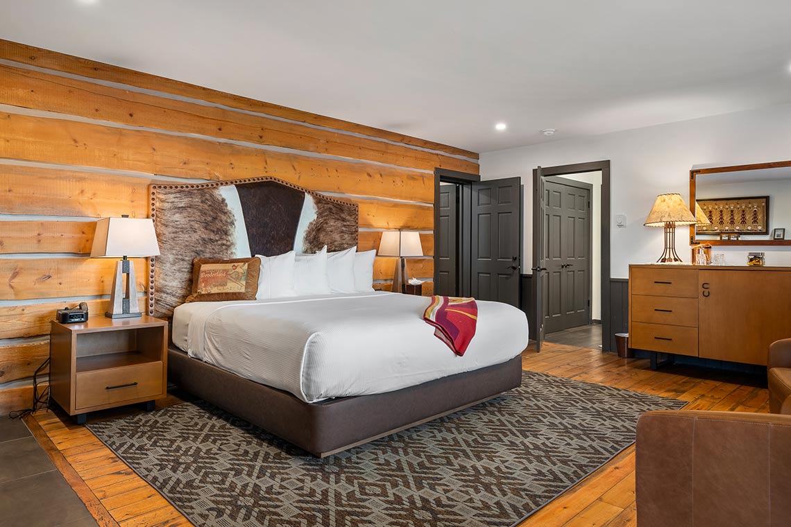 King bed in Roundup A with adjoining door open