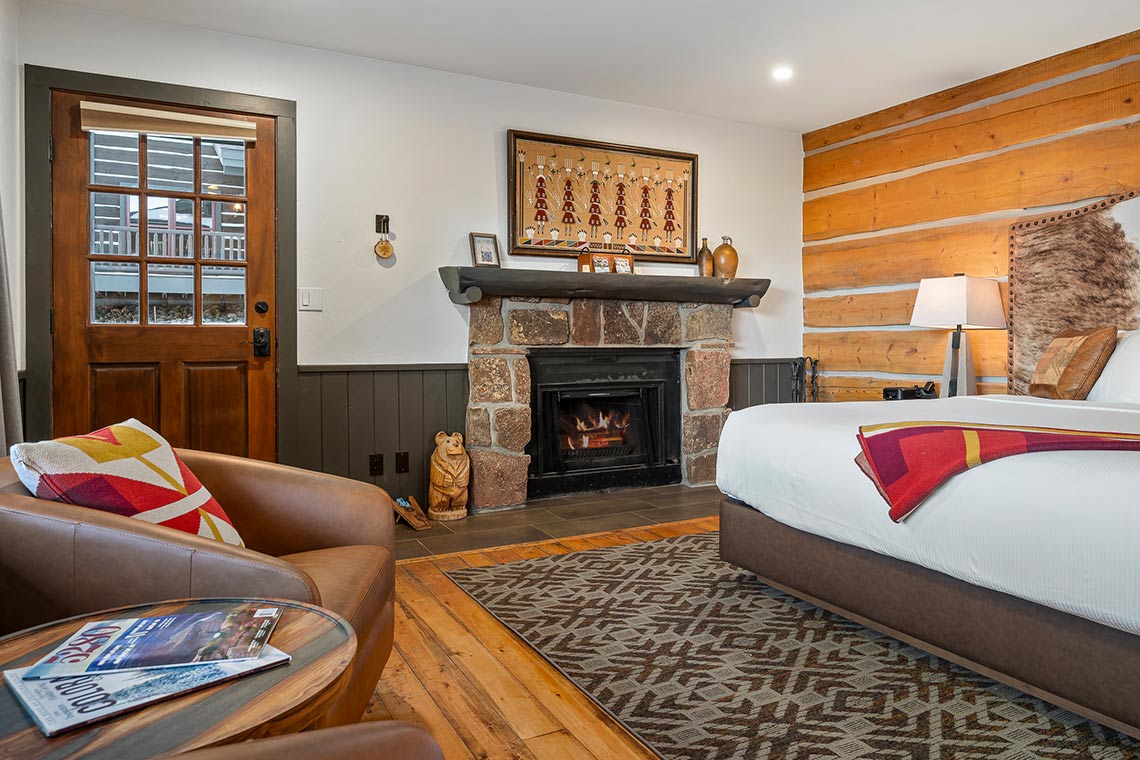 King bed, fireplace and sitting area in Roundup A