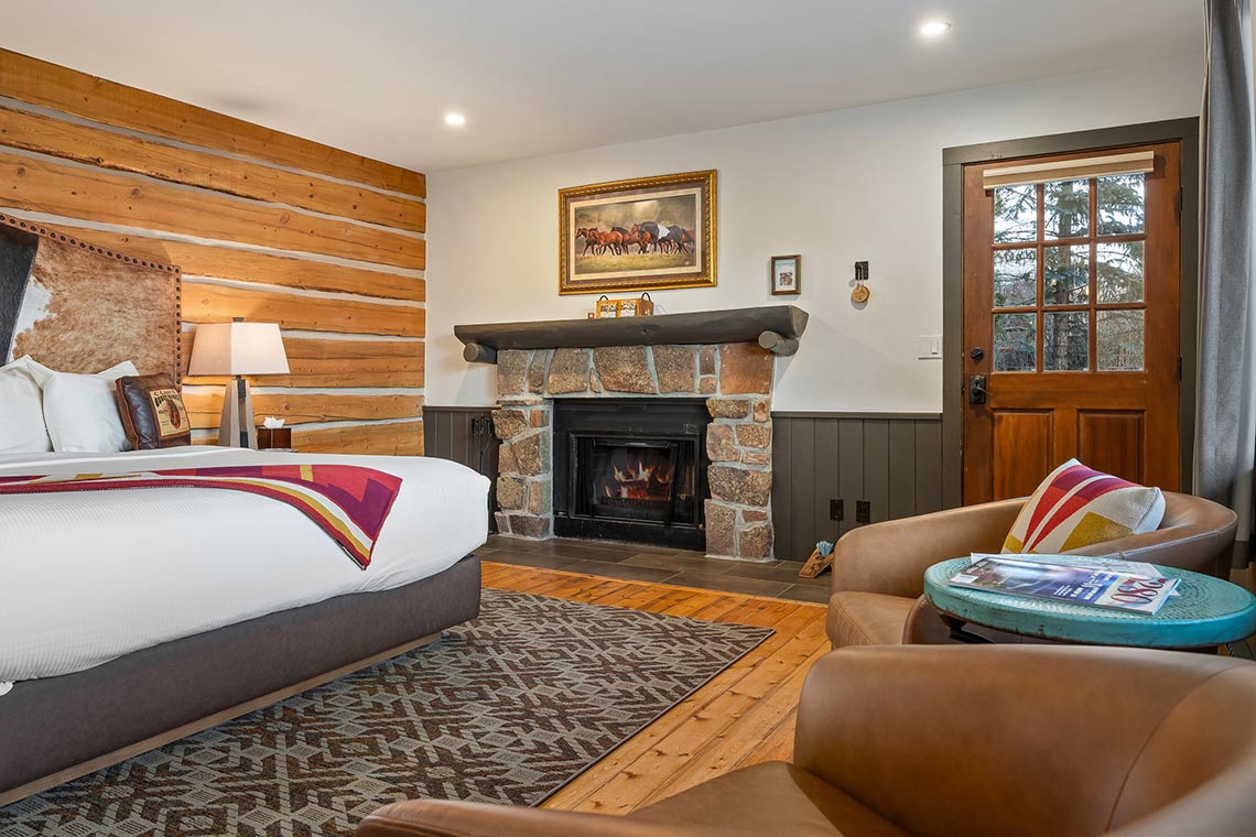 Roundup C showing the fireplace, bed, sitting area and outer door