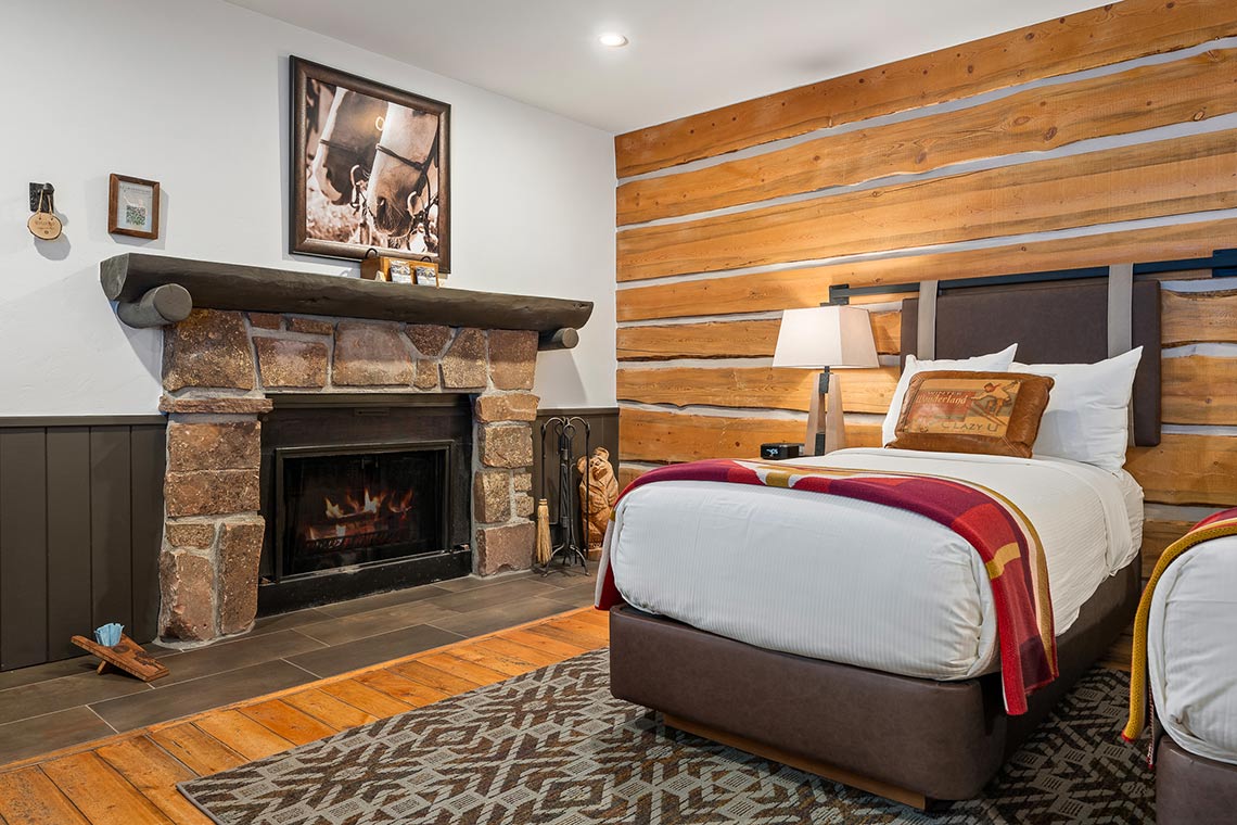 The fireplace in Roundup D with twin beds