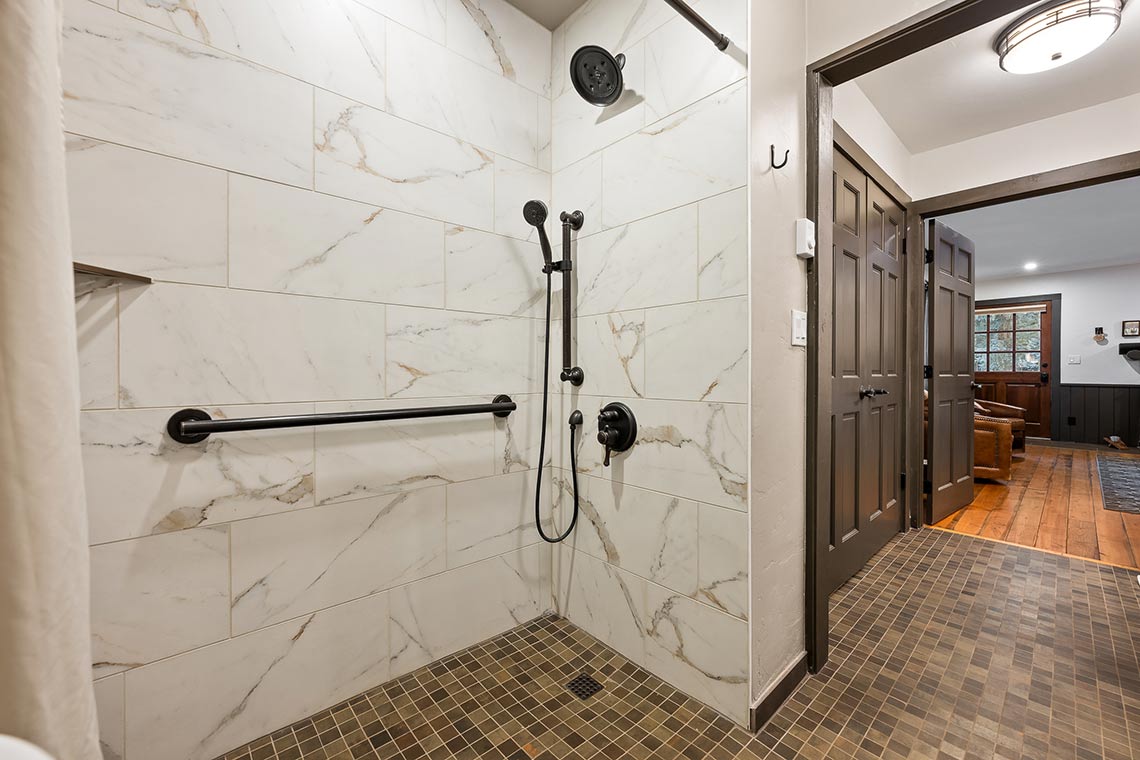 Walk-in shower in Roundup D's bath