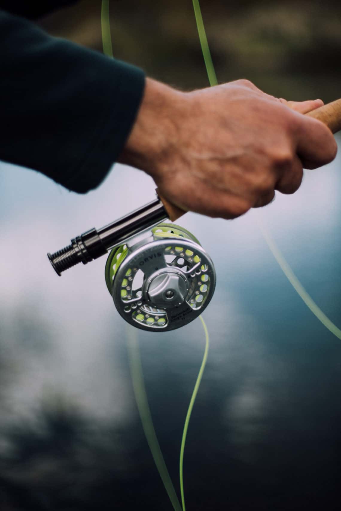 Closeup of man holding fishing pole