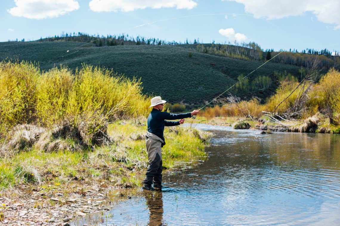 Man fly fishing at Orvis Fly Fishing Endorsed C Lazy U Ranch in Granby, Colorado