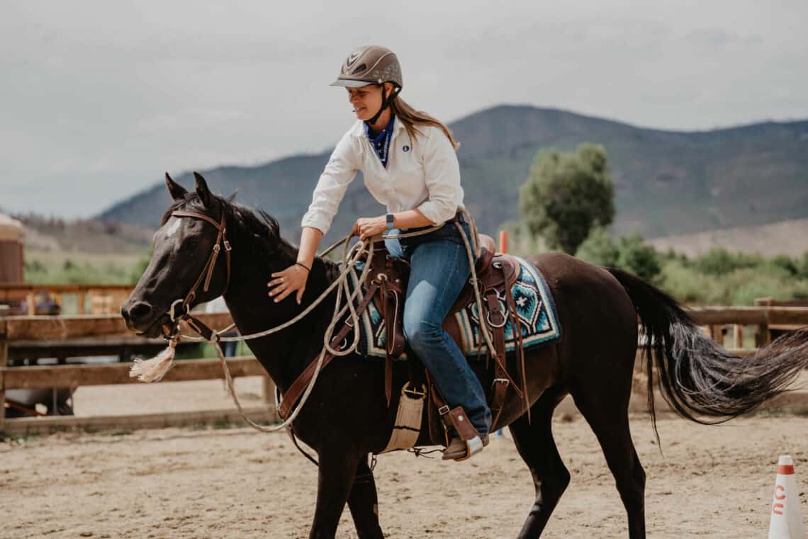 tami burkett caring for horses at C Lazy U dude ranch in Granby, Colorado