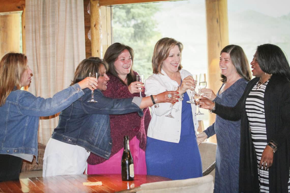 ladies cheersing wine