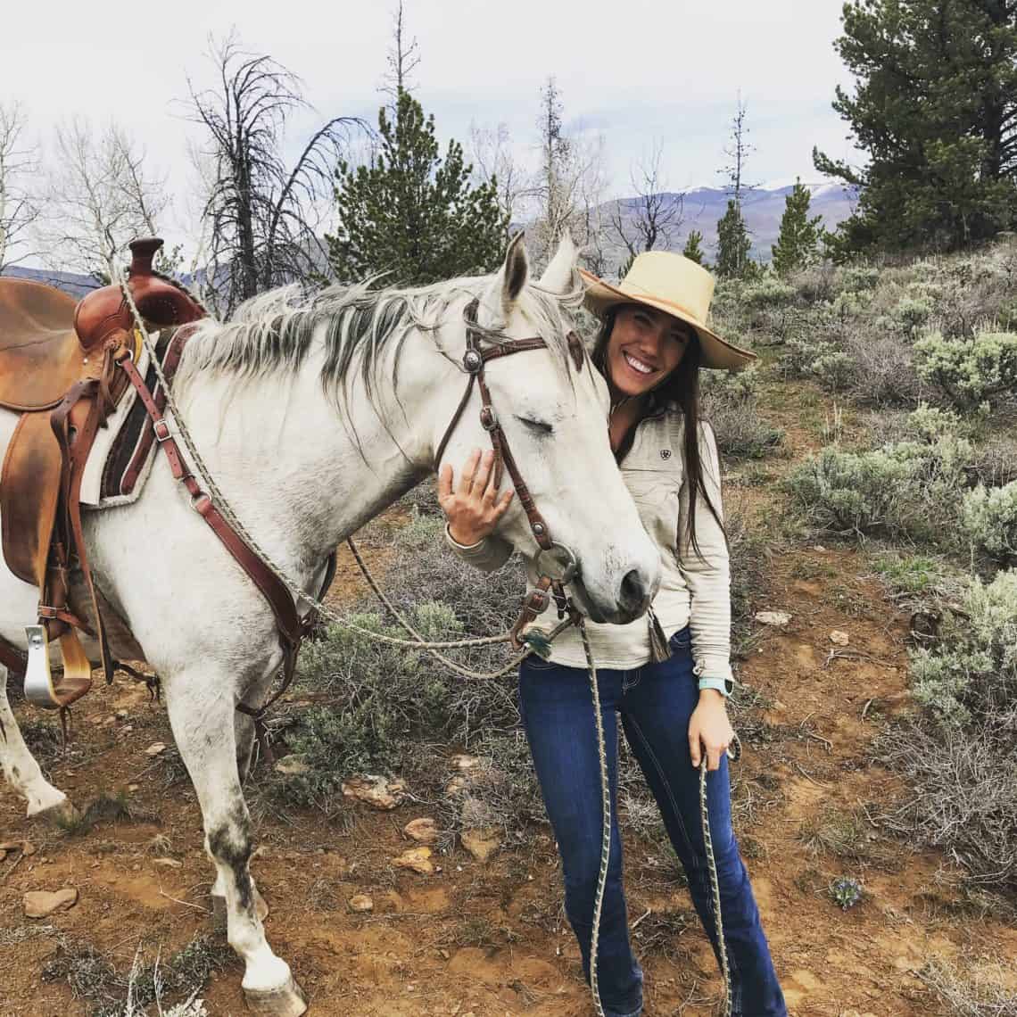 girl smiling with horse