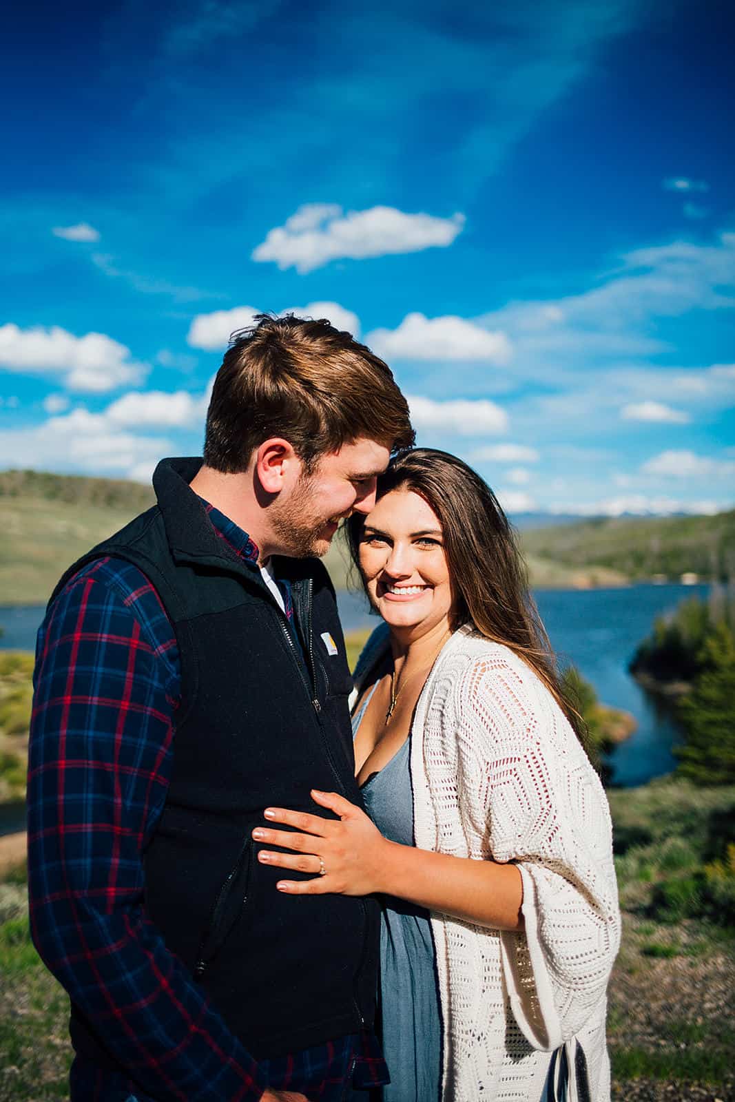 couple kissing in field