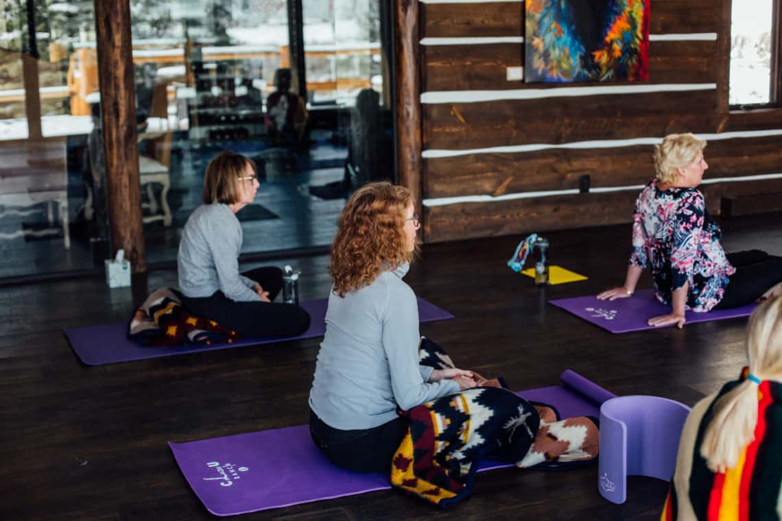 women doing yoga on ground