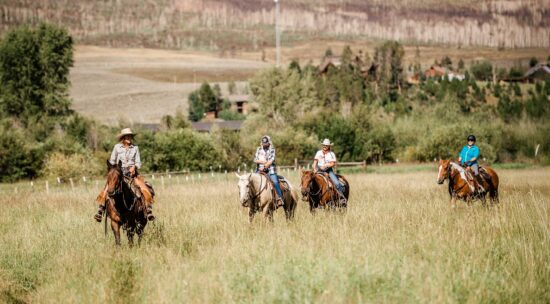 Adults out on a trail ride in October