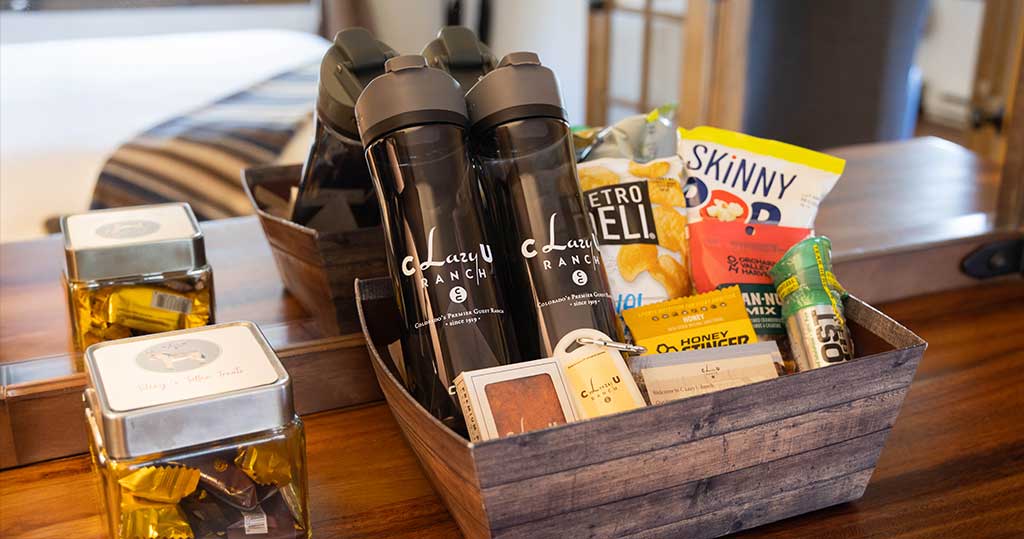 Amenity basket with water bottles and snacks