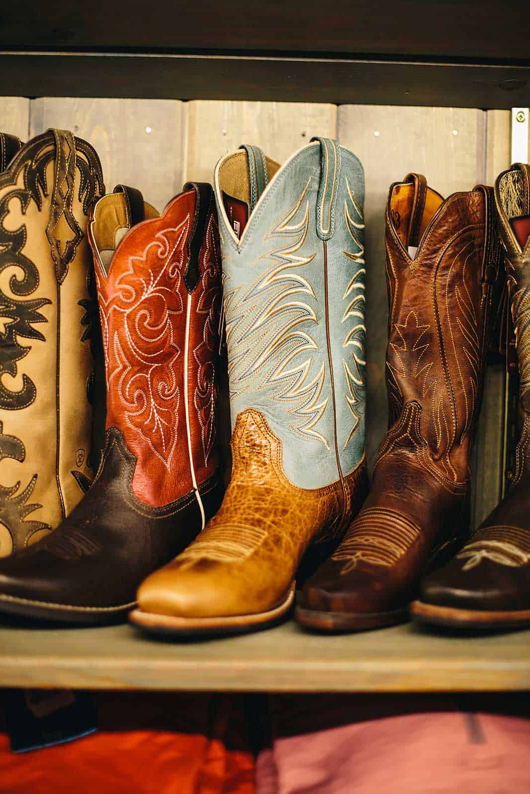 variety of cowboy and cowgirl boots at the ranch store