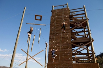 Navigating our ropes course teaches your group to help and trust each other - a perfect executive retreat exercise.