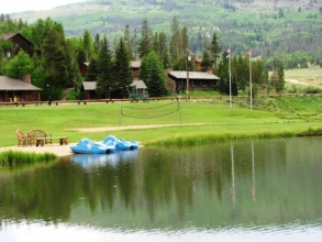 Enjoy the tranquility of the beautiful Colorado mountains while on a paddle boat on our guest ranch lake.