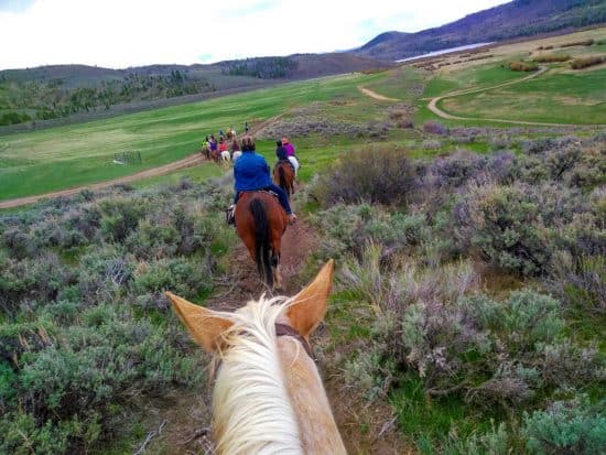 Women on trail ride during the 2018 Cathy Woods retreat