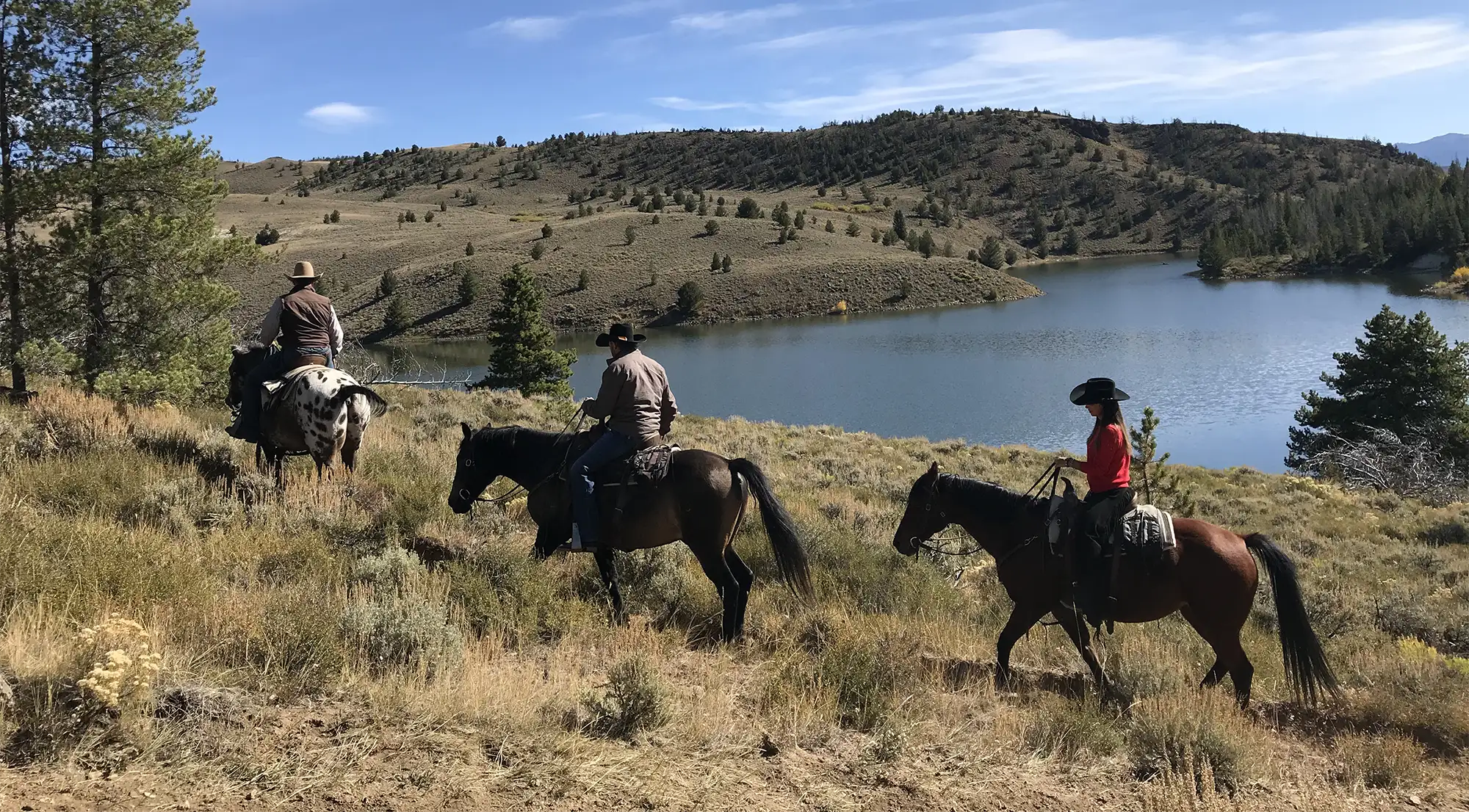 Riding past the reservoir in early Fall at C Lazy U Ranch