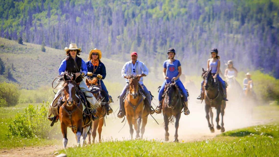 family-riding-horses