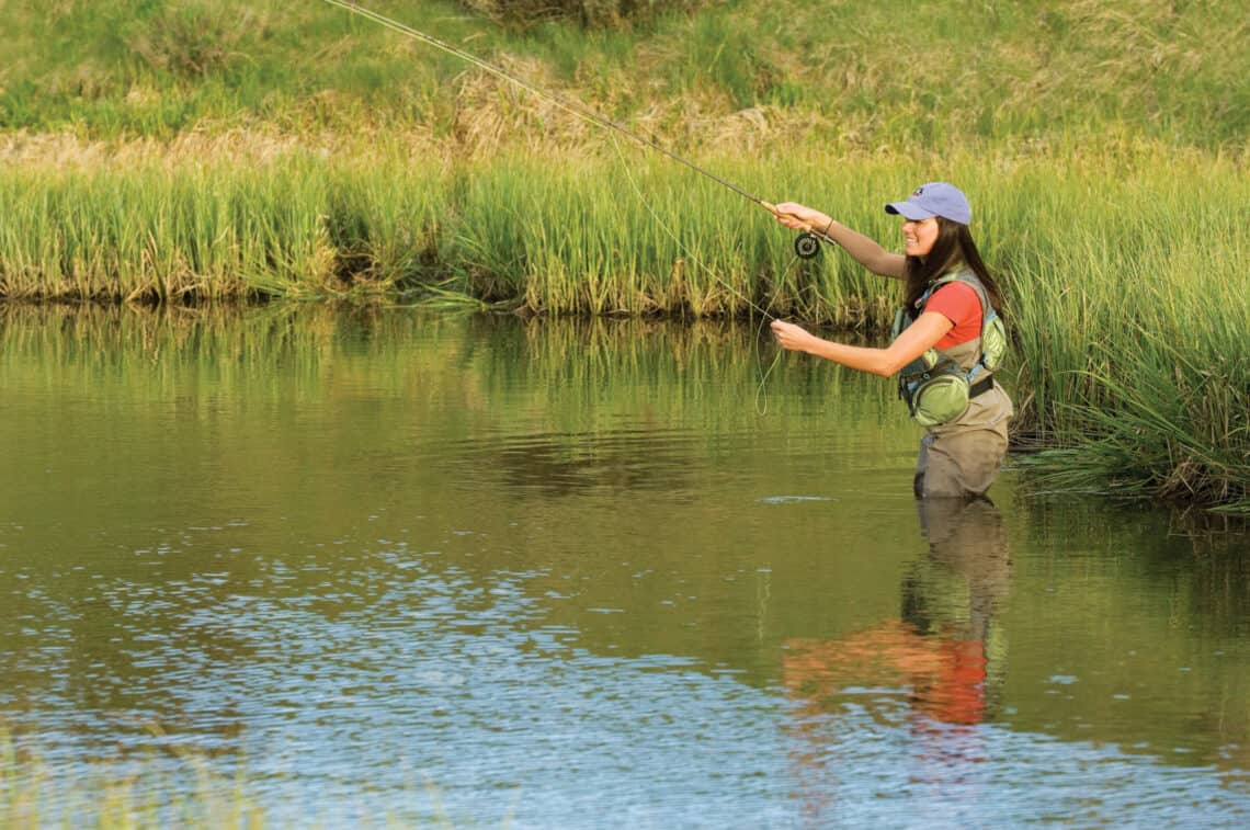 woman fly fishing at C Lazy U Ranch in Colorado