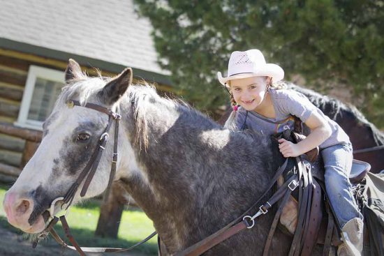 grinning-girl-on-horse