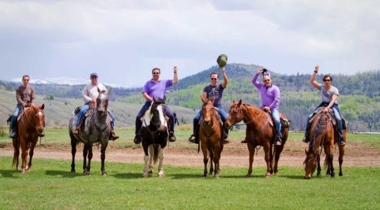 Adult riders happy to be on horseback