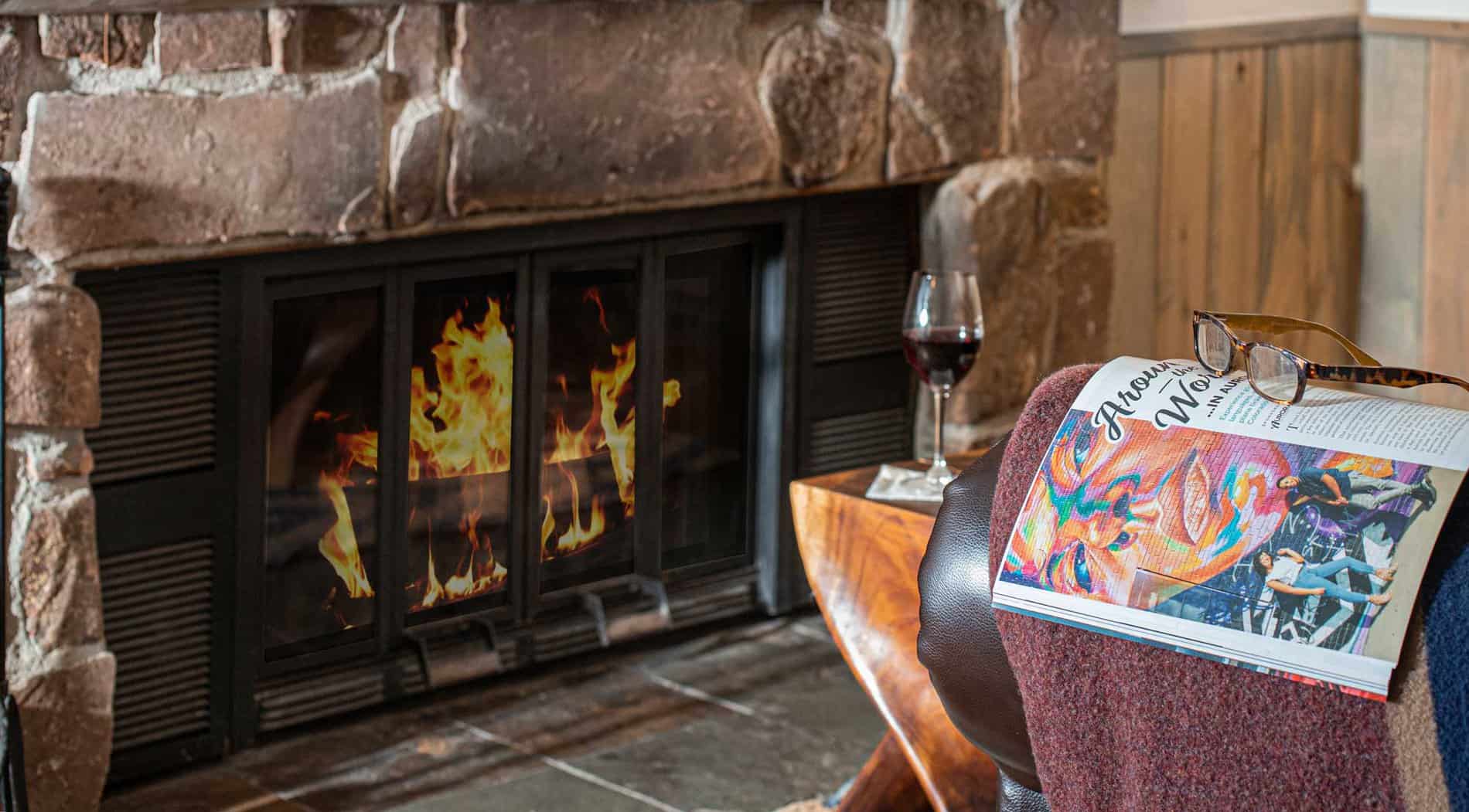 A glass of wine near the fireplace at Colorado luxury dude ranch C Lazy U