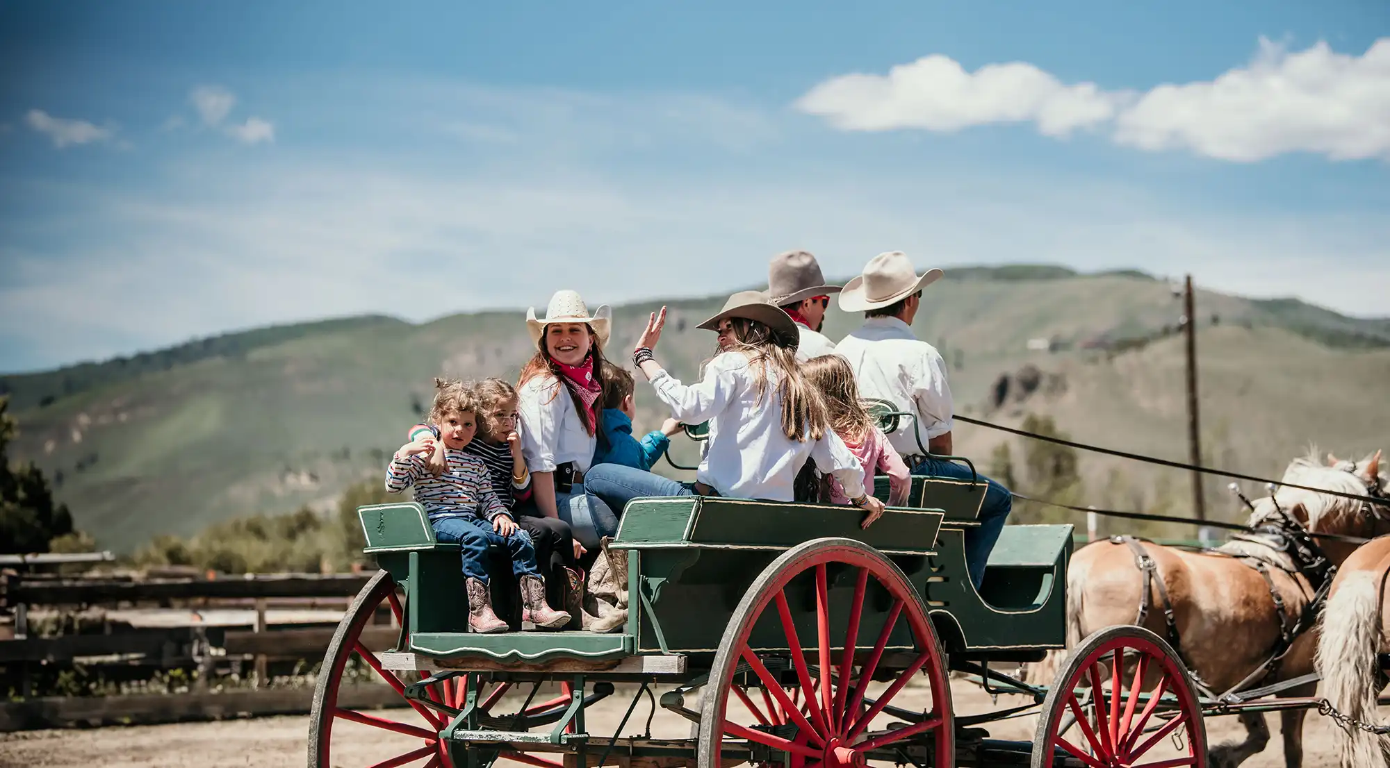 Kids counselors on a wagon ride with kids