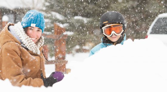 Two people playing in snow