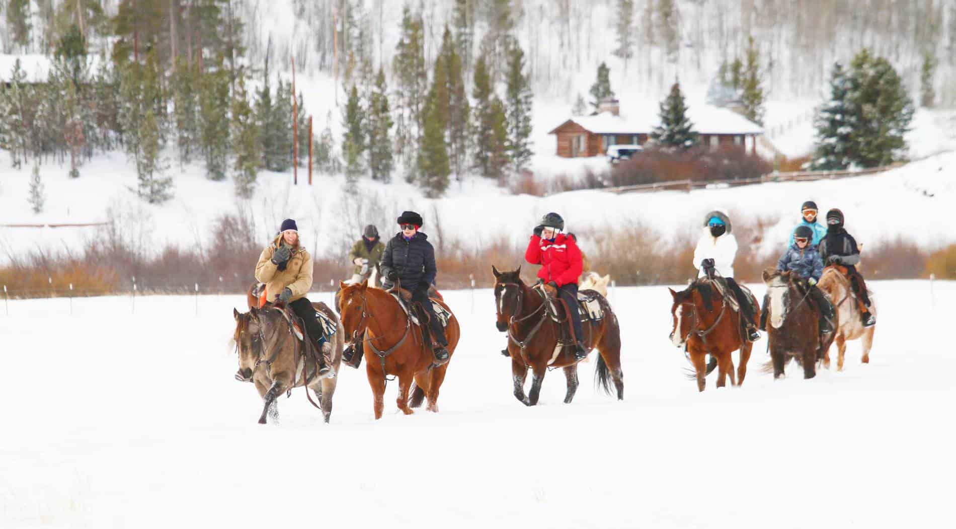 Horseback riders in the snow