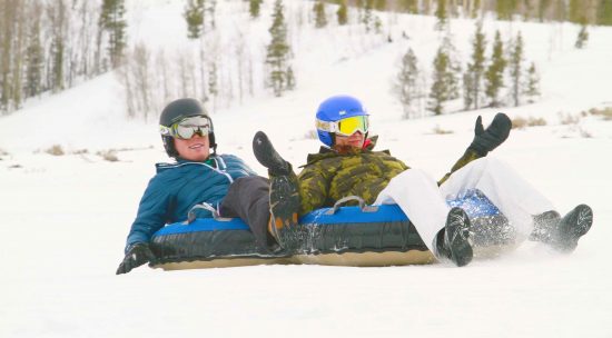 Two snow tubers