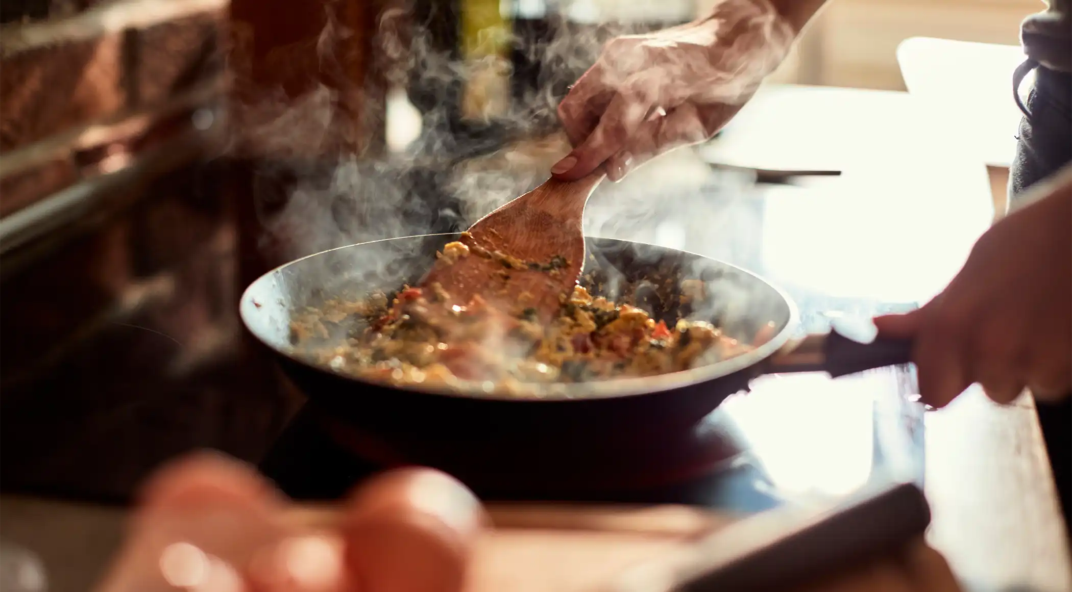 closeup of a chef sautéing nourishing food