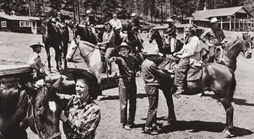 historical photo of saddling up at the barn