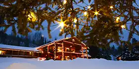 C Lazy U Ranch lodge decorated with Christmas lights for the holidays