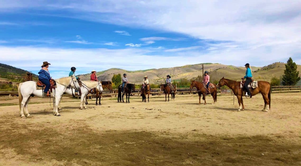 Participants in a Julie Goodnight clinic in the C Lazy U outdoor arena