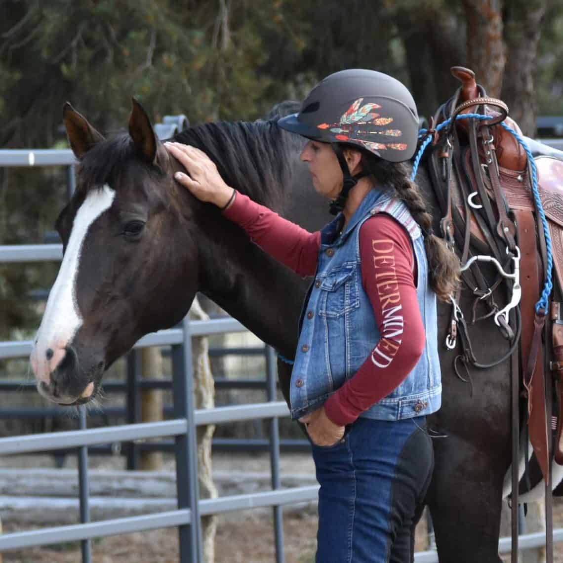Julie Goodnight with her horse at a clinic