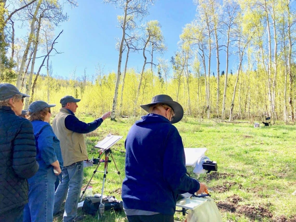 Randy Hale teaching an outdoor painting class amongst the yellow aspens