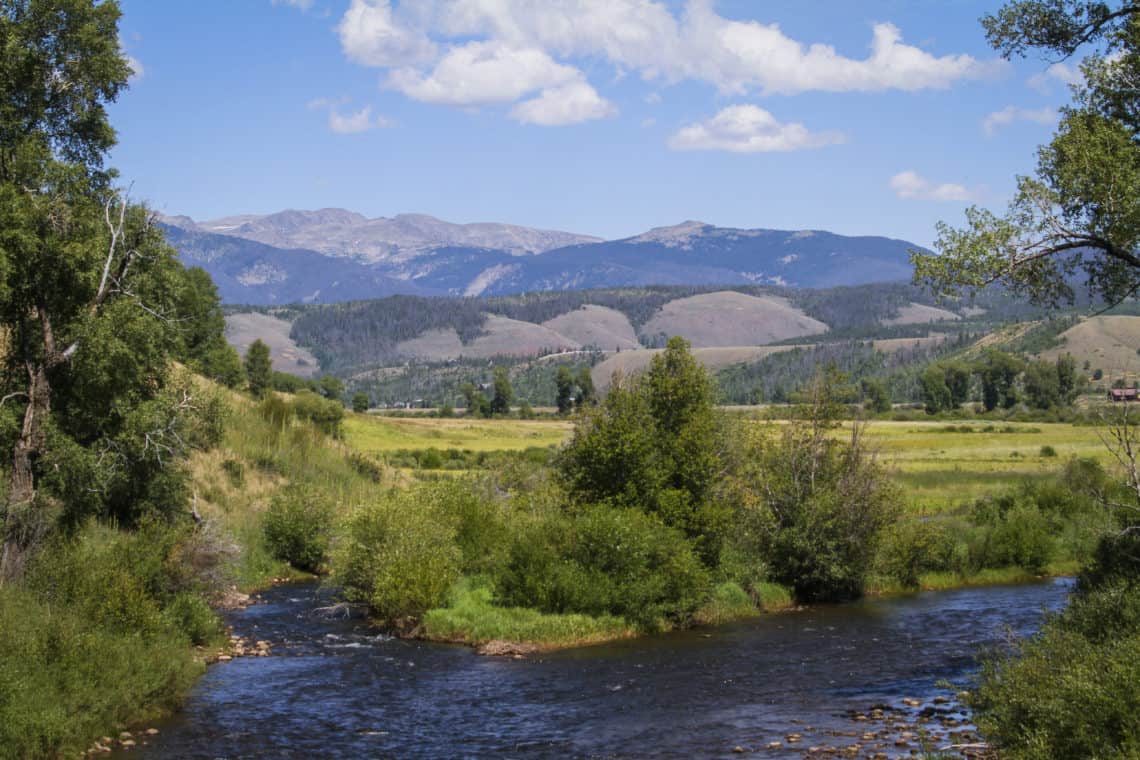 Pond with mountains in the background