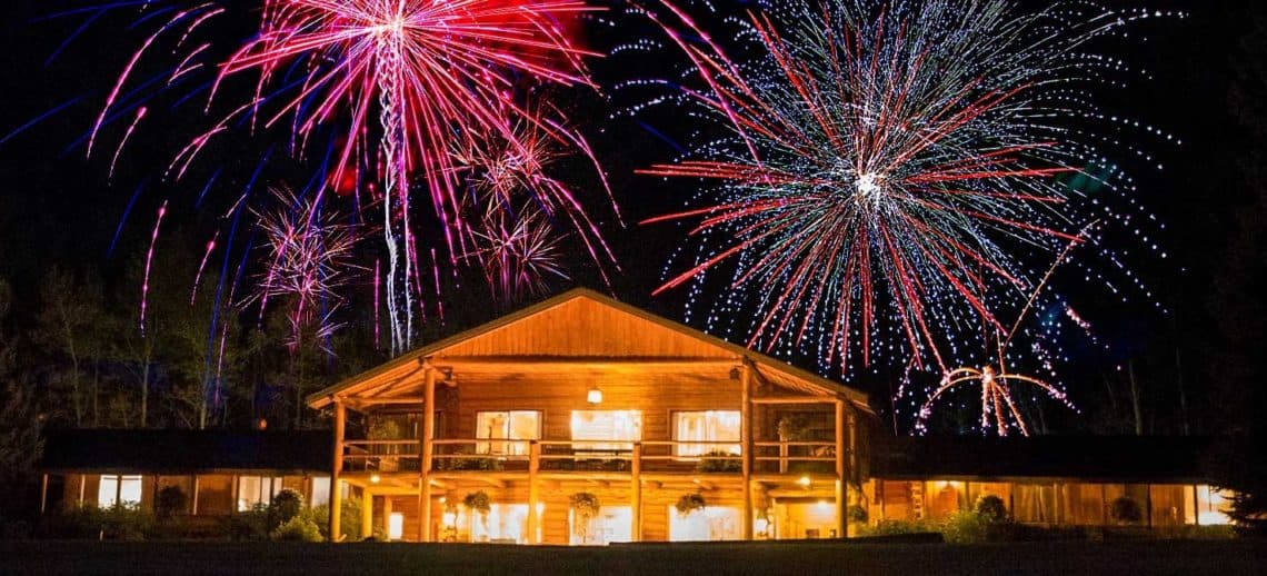 lodge at night with fireworks