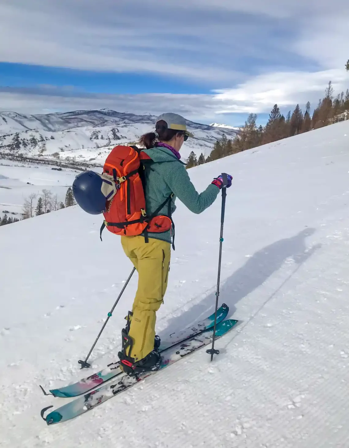 A woman skinning uphill