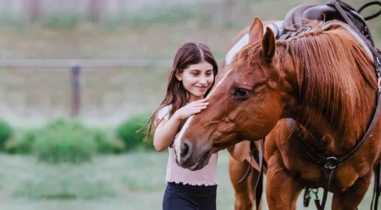 a girl in love with her horse during summer vacation at C Lazy U Ranch