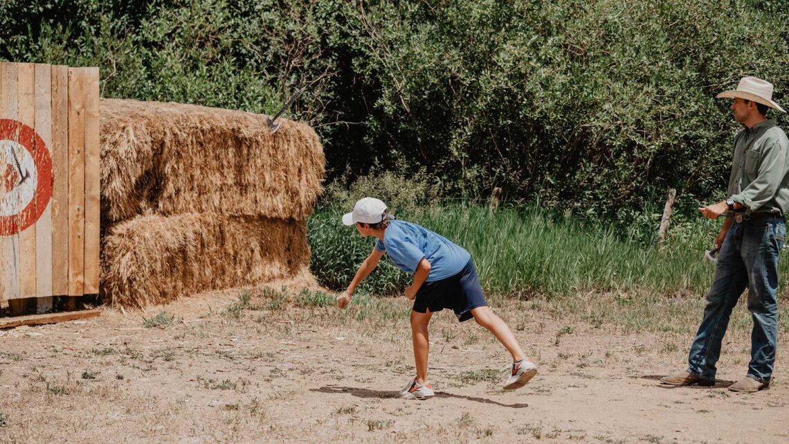 summer-teen-boy-hatchet-throwing